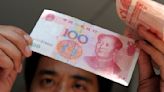 Hong Kong-listed companies slash dollar borrowings in favor of yuan