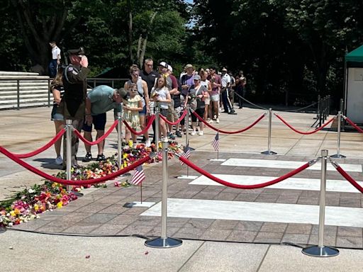 Guests leave hundreds of flowers to honor the Tomb of the Unknown Soldier