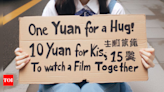 'One yuan for hug, 10 yuan for kiss ...': Increasing 'street girlfriends' trend in China offers no-sex companionship - Times of India