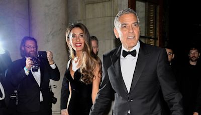 George Clooney plays photographer at star-studded charity event