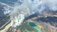 This August 3 2024 image obtained from the Jasper National Park in Canada, shows fire activity near Lake Edith