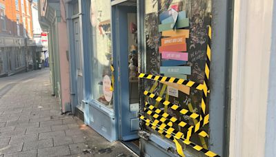 Pride flags and shopfront set on fire in city centre