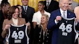 U.S. President Joe Biden and Vice President Kamala Harris are presented jerseys as they welcome the Las Vegas Aces to celebrate...