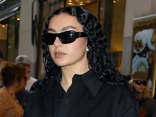 Charli XCX wears racy leather hot pants and chaps after going braless in another sexy look as she steps out in New York