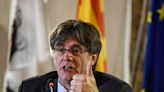 Fugitive Catalan chief Puigdemont pledges he will return to Spain if he can be restored to power