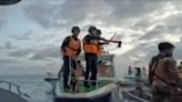 Video shows Chinese coast guard brandishing an ax in a low-tech clash with the Philippines navy