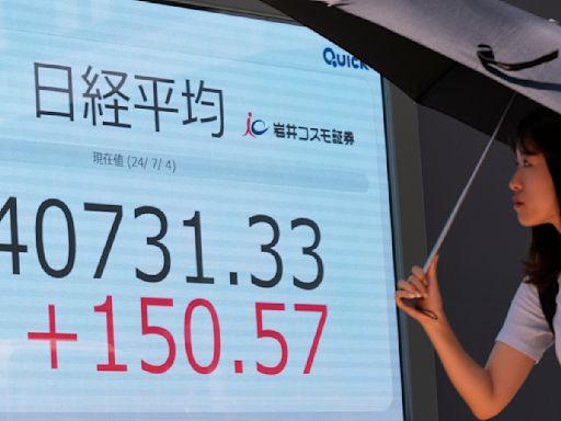 Stock market today: Asian shares are mostly higher after Wall Street hits more records