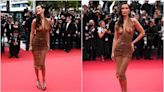 Bella Hadid arrives at Cannes Film Festival in a brown Saint Laurent sheer dress that leaves little to the imagination