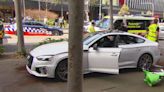 Two people rushed to hospital after being hit by car outside Sydney shopping centre
