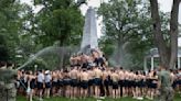 A greasy, monumental ritual at the Naval Academy ends after more than 2 hours