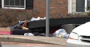 Mother and daughter upset when their belongings are thrown onto the curb after an apartment fire