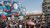 As crowds mourn Iran’s Raisi, others celebrate behind closed doors