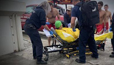 Shark attack victim punched it in the face before he was rescued, friend says