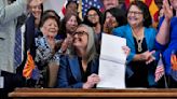 Arizona's Democratic governor signs a bill to repeal 1864 ban on most abortions