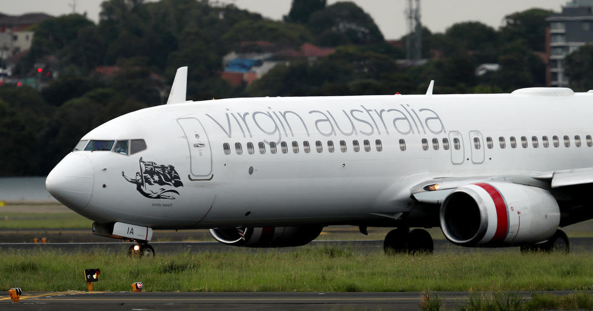 Passenger accused of running naked through Virgin Australia airliner mid-flight, knocking down crew member