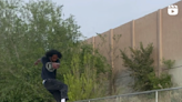 Snowboarder Battles a Skateboard Trick