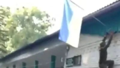 Watch moment cheering Ukrainian soldiers raise FLAG in ‘occupied’ Russia