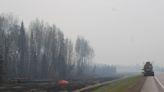 Banners hung by B.C. firefighters welcome evacuees back to Fort Nelson