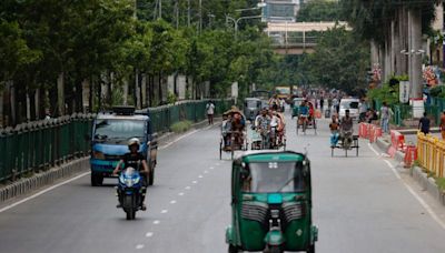 Bangladesh factories, banks reopen as curfew is eased after protests taper off