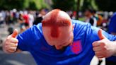 Barber who shaved St George cross into his hair among fans in Berlin