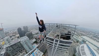 Daring performance artist who walked across LA's ‘Graffiti Towers' speaks out