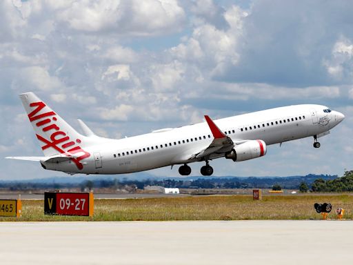 Woman dies after collapsing on Virgin Australia flight in front of horrified passengers