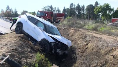 Woman hits power pole, crashes into stop sign, ends up in Fresno County canal