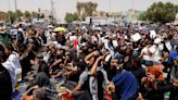 Iraqi factions call for new government in rival protests