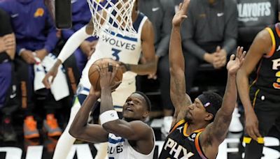 Timberwolves outlast Suns to finish sweep. Minnesota coach Chris Finch leaves with knee injury