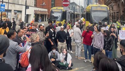 Protesters block tram tracks after police airport footage | ITV News