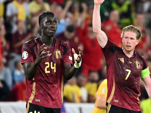 Belgium recover from horror opener to sink Romania with Group E on a knife-edge