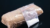 Man held with 1-kg heroin