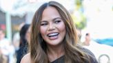 Chrissy Teigen Bares Baby Belly in Lingerie and Cozy Robe