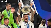 Real Madrid's Joselu holds the trophy as he celebrates a 2-0 victory at the end of the UEFA Champions League final against Borussia Dortmund at Wembley Stadium...