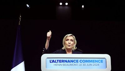 Marine Le Pen’s far-right National Rally party take the lead in first round of French election voting
