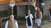 Cut-outs of India's Prime Minister Narendra Modi and his Bharatiya Janata Party candidate Parshottam Rupala at an election campaign venue in Rajkot district in Gujarat