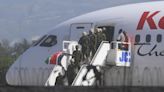 UN-backed contingent of foreign police arrives in Haiti as Kenya-led force prepares to face gangs