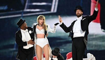 Travis Kelce Makes Surprise ‘Eras Tour’ Appearance Onstage, Revives Taylor Swift After Heartbreak | Video