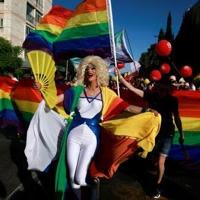 Rainbows and yellow ribbons mingle at Jerusalem Pride as marchers call for gay rights and the release of hostages held in Gaza at an event clouded by the war in Gaza