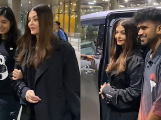 Aishwarya Rai poses with paparazzi as she returns from Paris Fashion Week