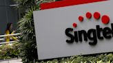 SingTel annual profit more than halves on $2.3 bln impairment charge