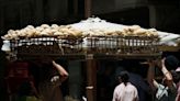 Egyptians struggle with first bread subsidy cut in decades