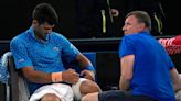 Novak Djokovic plays through the pain to beat Grigor Dimitrov at Australian Open
