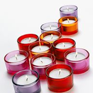Votive candles are small, cylindrical candles that are typically used in decorative holders. They can be unscented or scented and come in a variety of colors. Votive candles are popular for their affordability and versatility.