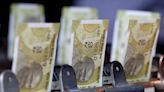 Rupee ends tad lower after hovering in narrow band; forward premiums slip