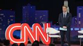 Jake Tapper's teenage kids respond to protesters outside home by waving, playing national anthem