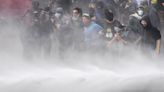 Argentine riot police disperse protesters with water cannons and tear gas ahead of key Senate vote - WTOP News