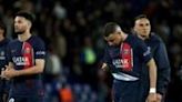 Kylian Mbappe walks off the pitch with PSG teammates after the French side's 3-2 defeat by Barcelona in the first leg of their Champions League quarter-final tie