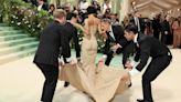 Met Gala behind-the-scenes video shows star being lifted up stairs in tight gown