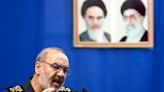 Iran warns it will react decisively if attacked and won't 'leave any threat unanswered' as US plans response to American troops deaths